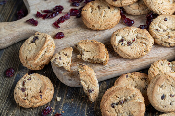 delicious dried cookies made of high-quality flour with dried red cranberries on the table