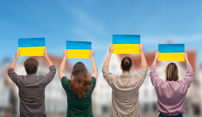 independence day, patriotic and human rights concept - group of people holding flags of ukraine on...