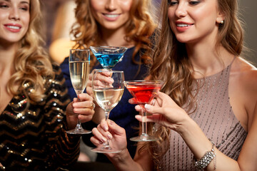 celebration, bachelorette party and holidays concept - group of happy women drinking champagne and...
