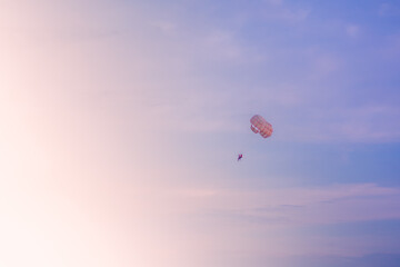 Parasailing in blue sky on sunny day