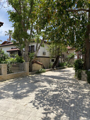 Side Antalya: The streets of the city in Side, Antalya. Street view. Cafe, restaurant, shop and houses.