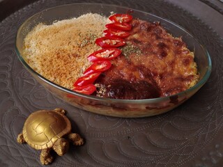 very tasty pasta with cheese in a glass bowl