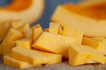 ripe orange pumpkin while cooking food in the kitchen