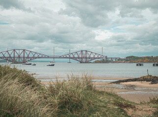 View across the Firth of forth, Edinburgh, Scotland. The tide is out and the famous forth rail...
