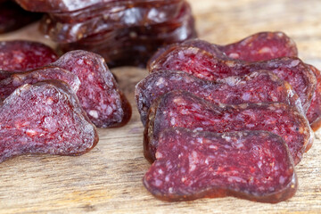 sliced piece of cured sausage on the table