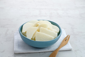 A bowl of fresh jicama or bengkoang (Jicama slices), gut health.

