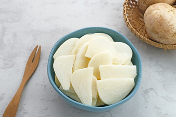 A bowl of fresh jicama or bengkoang (Jicama slices), gut health.
