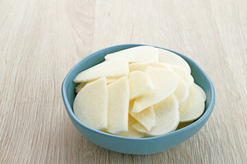 A bowl of fresh jicama or bengkoang (Jicama slices), gut health.
