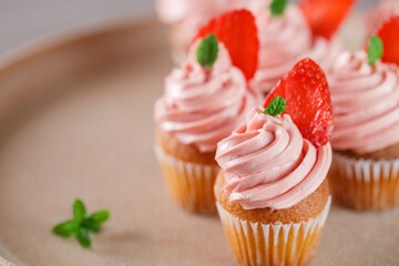 Cupcake with cream and strawberry