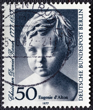 GERMANY-BERLIN - CIRCA 1977 : a postage stamp from GERMANY-BERLIN, showing a picture of the child bust of Eugenie d'Alton for the 200th birthday of Christian Daniel Rauch .Circa 1977
