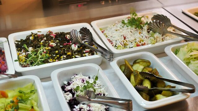 Containers with food in buffet restaurant