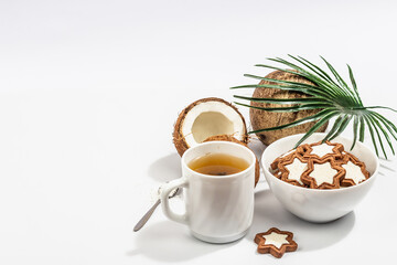 Gluten-free and lactose-free coconut cookies. Homemade healthy pastries, green tea, sunny morning