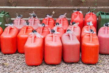 Large group of red and green fuel containers