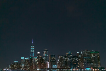 Fototapeta na wymiar Manhattan Skyline at night. Part of New York city viewed from Hudson river