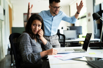 Colleagues arguing in office. Angry businessman yelling at his collegue.
