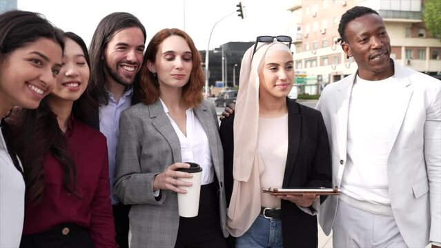 group of multiracial male and female business people, in financial district, diverse people working as a team