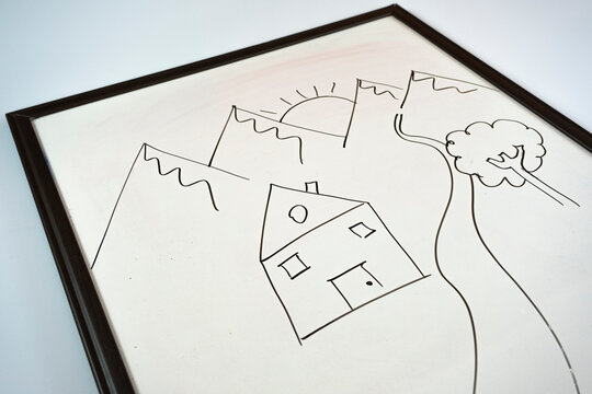 Hand drew house and river with black color marker on whiteboard, childhood idea, drawing pictures, kids concept, sitting view
