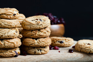delicious dried cookies made of high-quality flour with dried red cranberries on the table