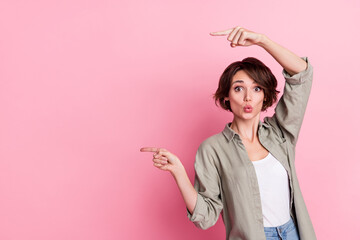 Photo of lady promoter impressed unbelievable promotion point empty space index finger isolated...