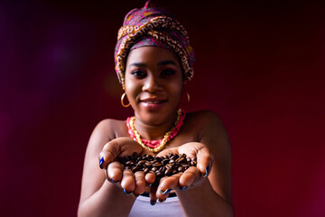 beautiful africa-american woman with turban ower the head in studio - obrazy, fototapety, plakaty