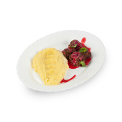 Mashed potatoes with meatballs on a white plate isolated without background.