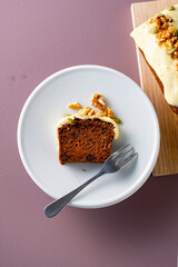 Sliced carrot cake on white plate.
Delicious carrot cake.