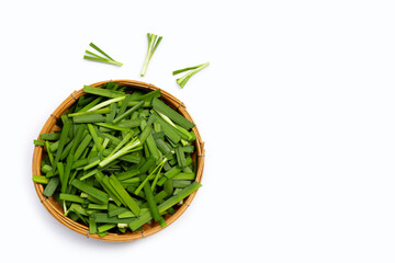 Fresh Chinese Chive leaves on white.