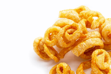 Fried crispy pork rinds on white background.