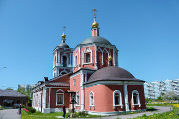 Fototapeta na wymiar Orthodox brick church and blue sky