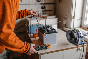 Mechanic doing service on electric car battery
