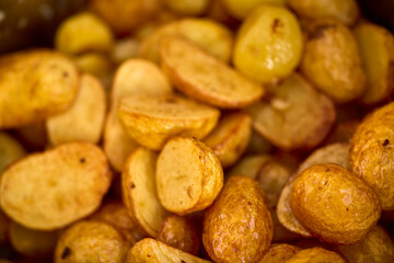 Baby potatoes fried in an iron pan in oil
