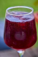 a glass of red wine and mineral water, also called Sprit.