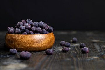 frozen blueberries on a wooden table