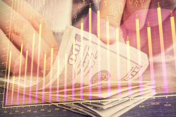 Multi exposure of forex graph drawing hologram and USA dollars bills and man hands. Technical Analysis concept.