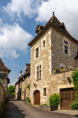 Fototapeta na wymiar narrow street with stone houses in an idyllic French country village