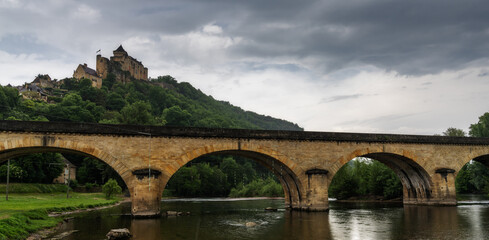 the castle in Castelnaud-la Chapelle with the Route de la Pagaie Bridge over the Dordogne River