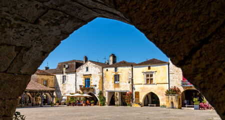 view of the Place des Cornieres Square in the historic city center of Monpazier