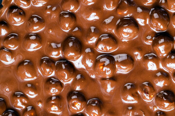 real milk chocolate while cooking with hazelnuts
