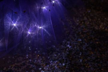 Detail of fairy or witch lilac glittery tulle skirt. Child costume.