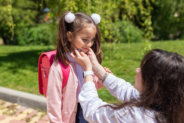 Obraz premium Child going back to school. Mother and kid getting ready for first school day after vacation