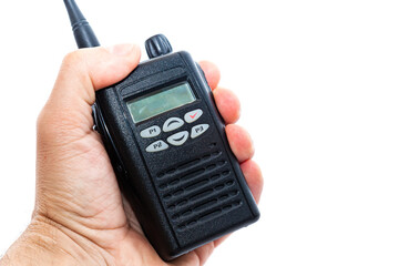 A man's hand holds a wireless walkie-talkie, on a white background, close-up.