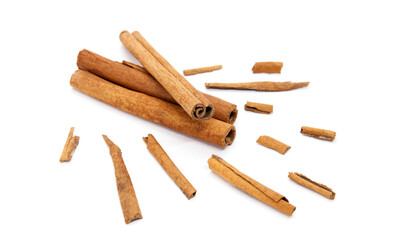 Big composition of cinnamon sticks on white background