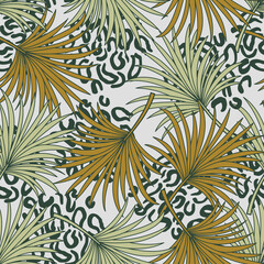 Fashionable tropical seamless pattern with bright plants and leaves on a light background. Beautiful seamless vector floral pattern. Tropic leaves in bright colors. Beautiful exotic plants. 
