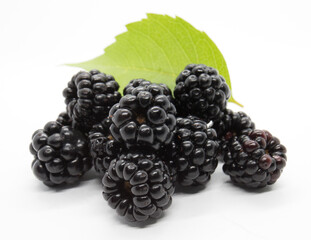 Groupe of Fresh juicy blackberries with green leaf on white background