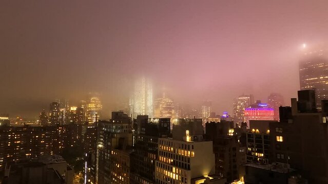 Fog Rolling in to large city at night
