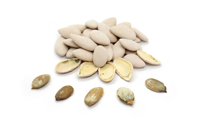 Pumpkin seeds whole and peeled on a white background