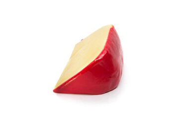 Quarter piece of Gouda cheese isolated on white background - side view