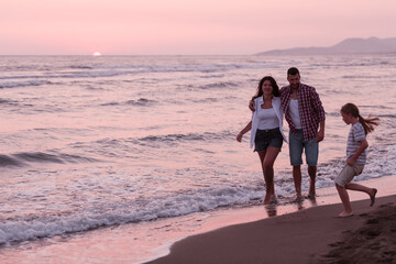  Family have fun and live healthy lifestyle on beach. Selective focus 