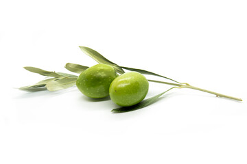 Two olives and olive leafs. Close-up, isolated on white background