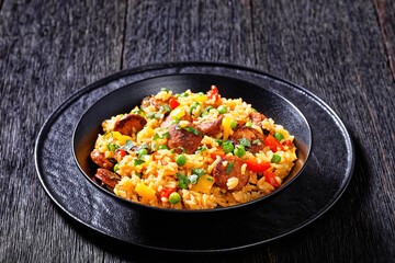 smoked sausages with rice and vegetables, top view